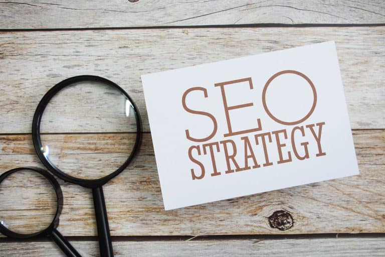 SEO Strategy On Page On Table With Magnify Glass