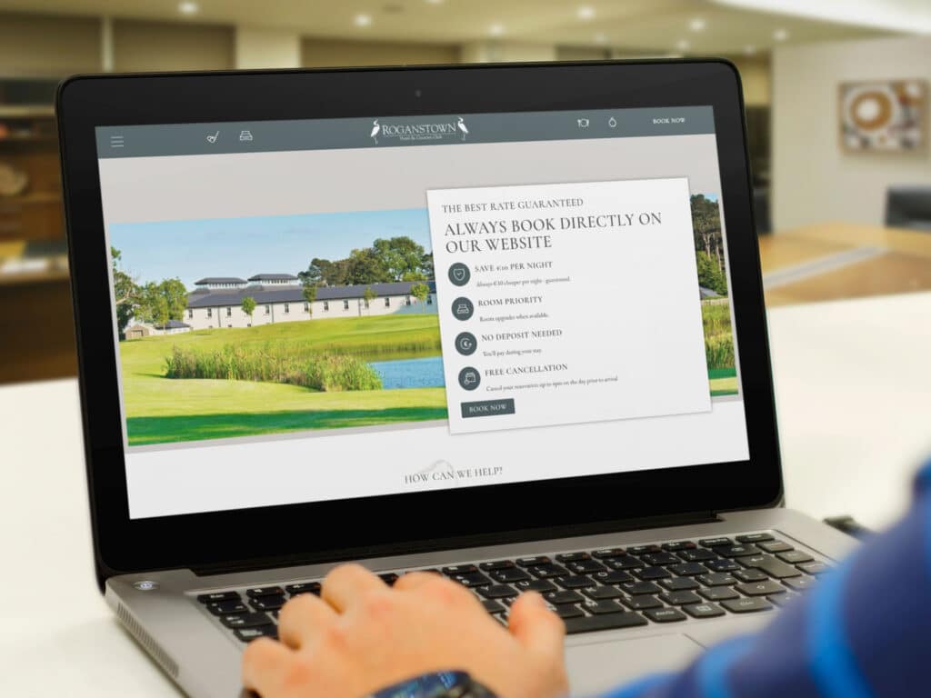 Man using laptop on Roganstown hotel website