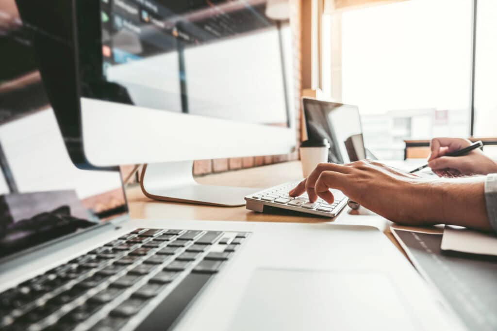 Man on computer typing